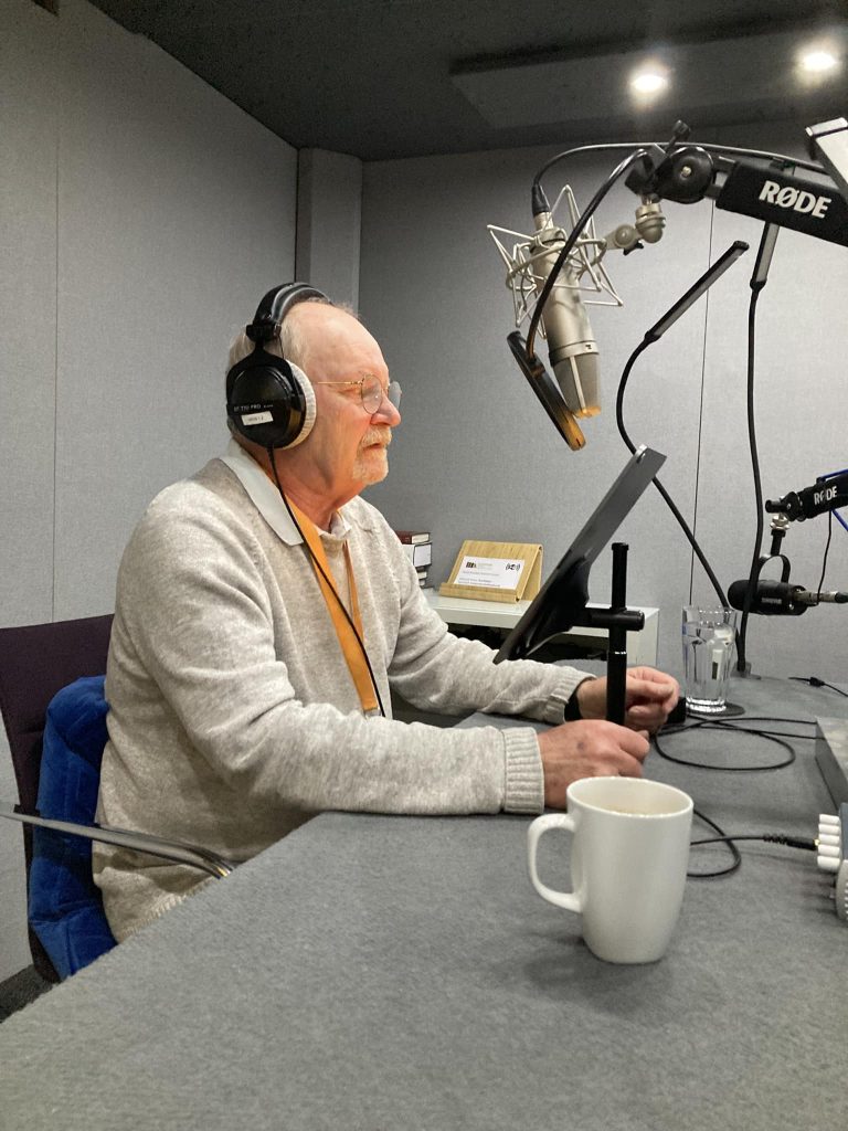 Picture of Barrie Jamieson in a radio studio recording