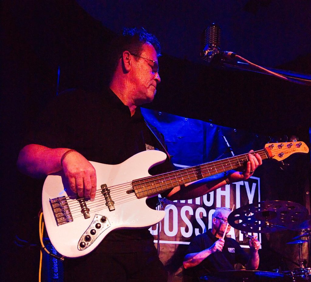 Artist playing a guitar